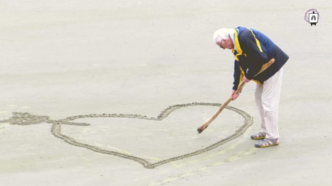 mayor dibujando anciano en la playa